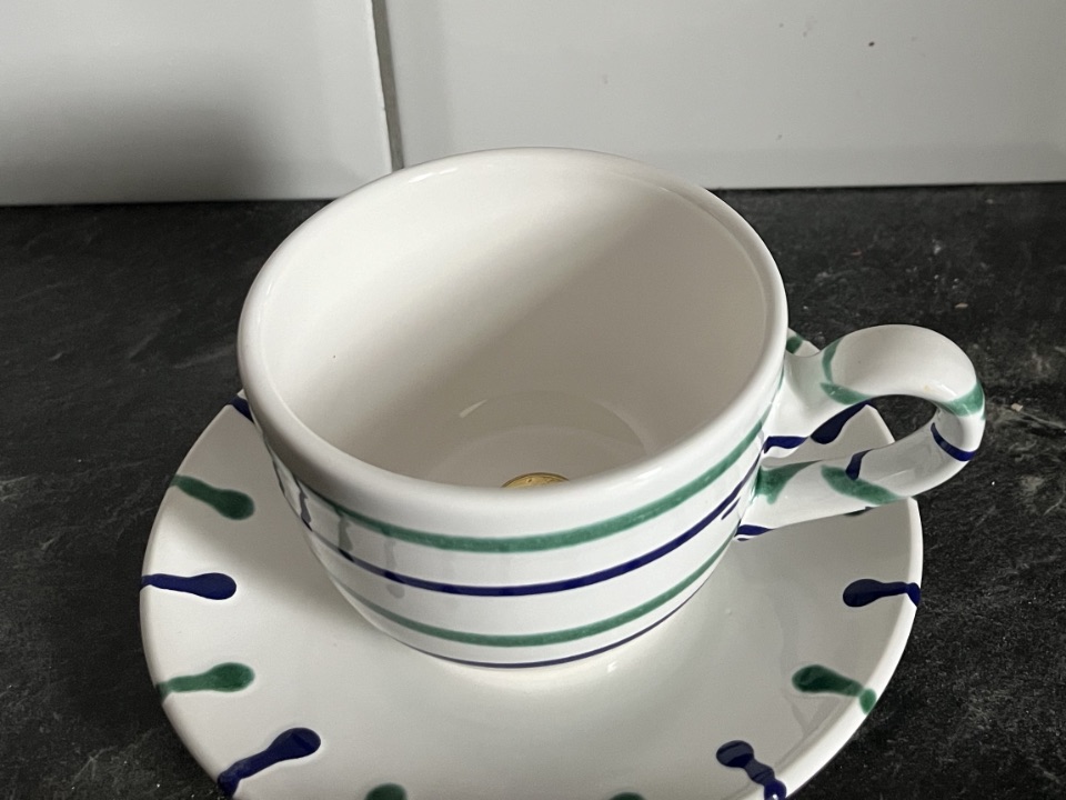 Tasse mit Münze